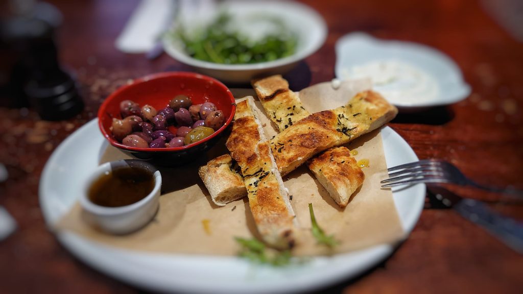 Bread and olives on plate