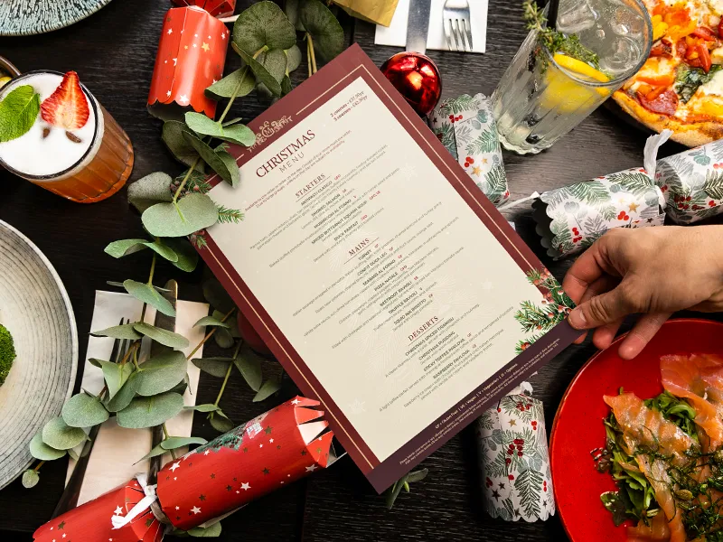 Marzano Italian Grill Christmas menu displayed on a festive restaurant table.
